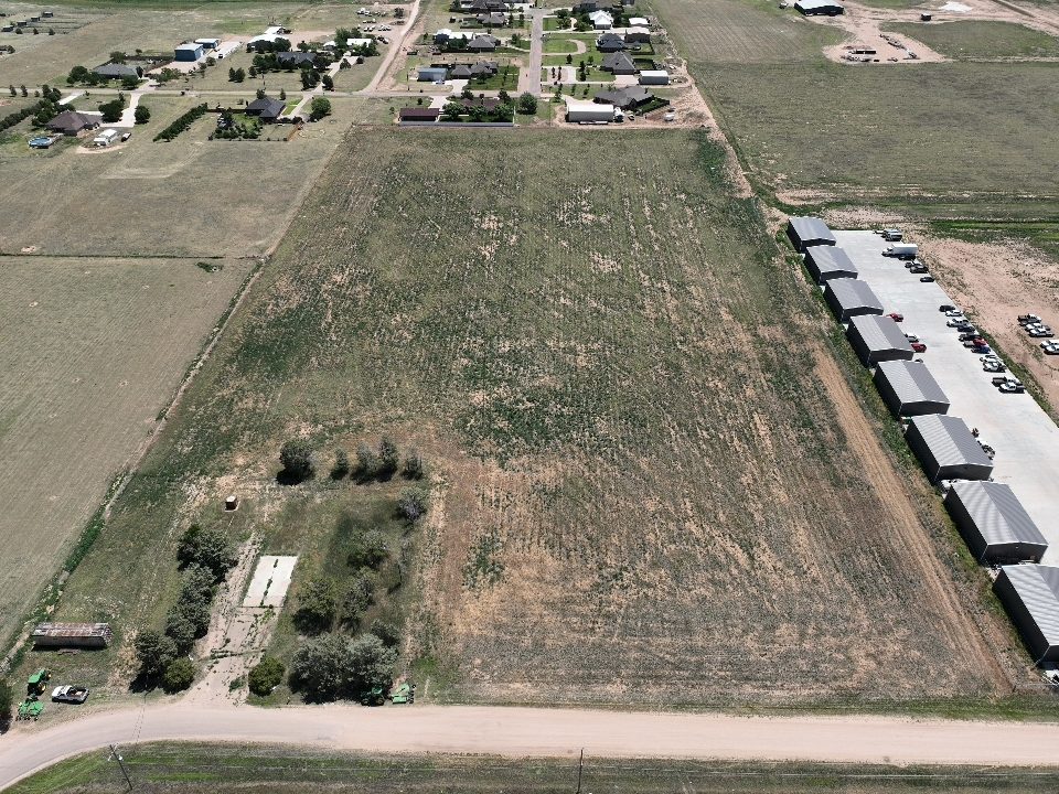 Aerial view of open acreage and a fence line near Amarillo